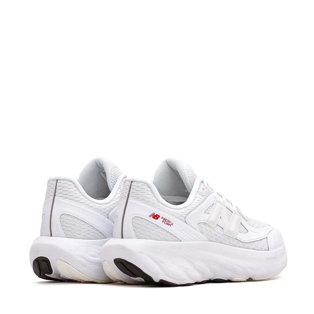 New Balance Unisex Fresh Foam Trainer White Sea Salt UTRNWE running in a beach area shoes