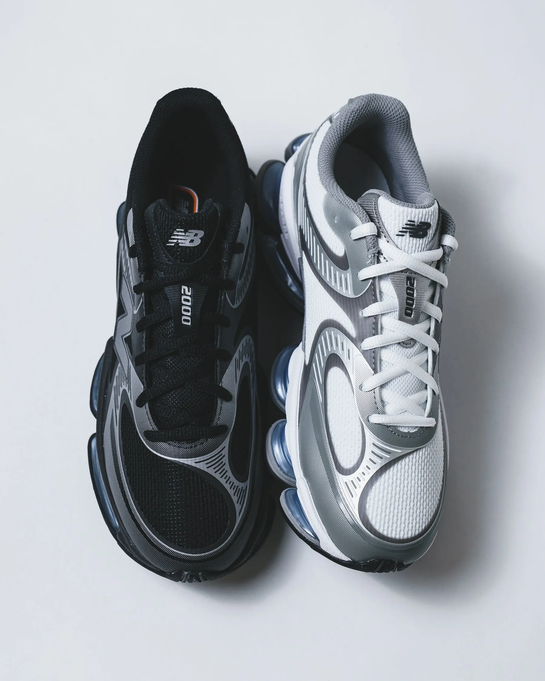 New Balance Unisex Abzorb 2000 White Silver Metallic Core U2000AA running in a tied - arch bridge area shoes